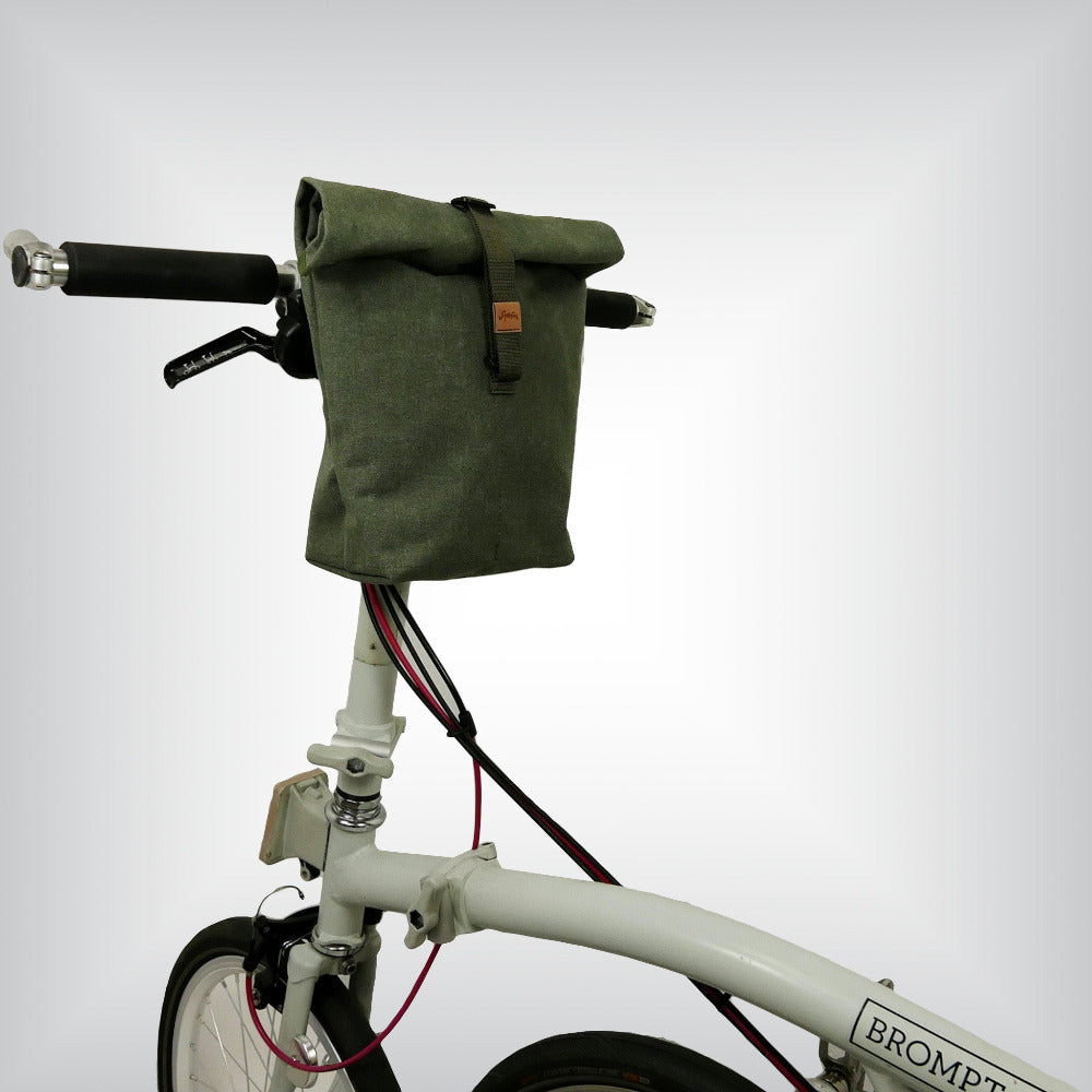 The Sergeant Handlebar Bag - Rugged and water-resistant canvas construction, double-layered back and flap enhance impermeability. Versatile three-position closure strap for adjustable volume. Five inside pockets keep your gadgets organized.