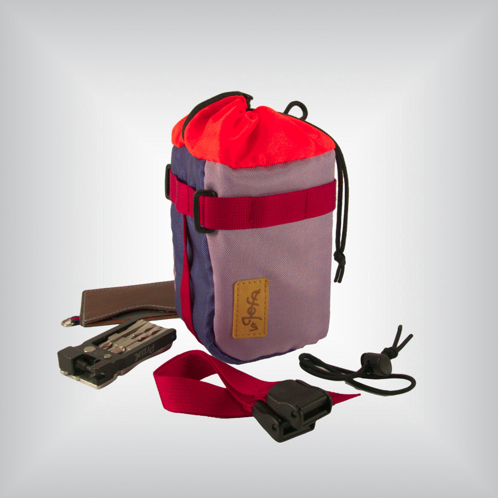 Bright colourful bikepacking bag with cycling multitool, wallet, bungee rubber cord and 2 mounting straps.