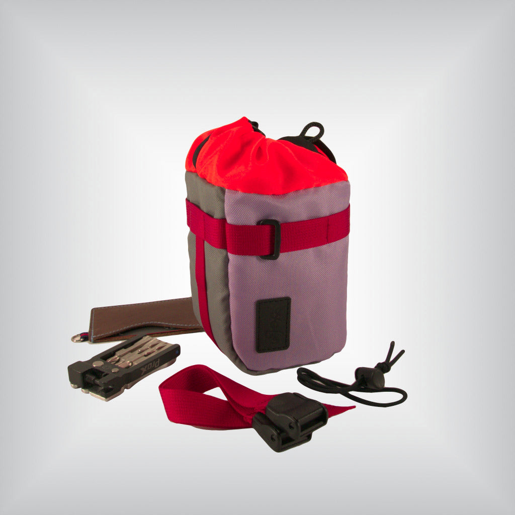 Bright lilac and grey cycling feed bag with cyclist' essencials.