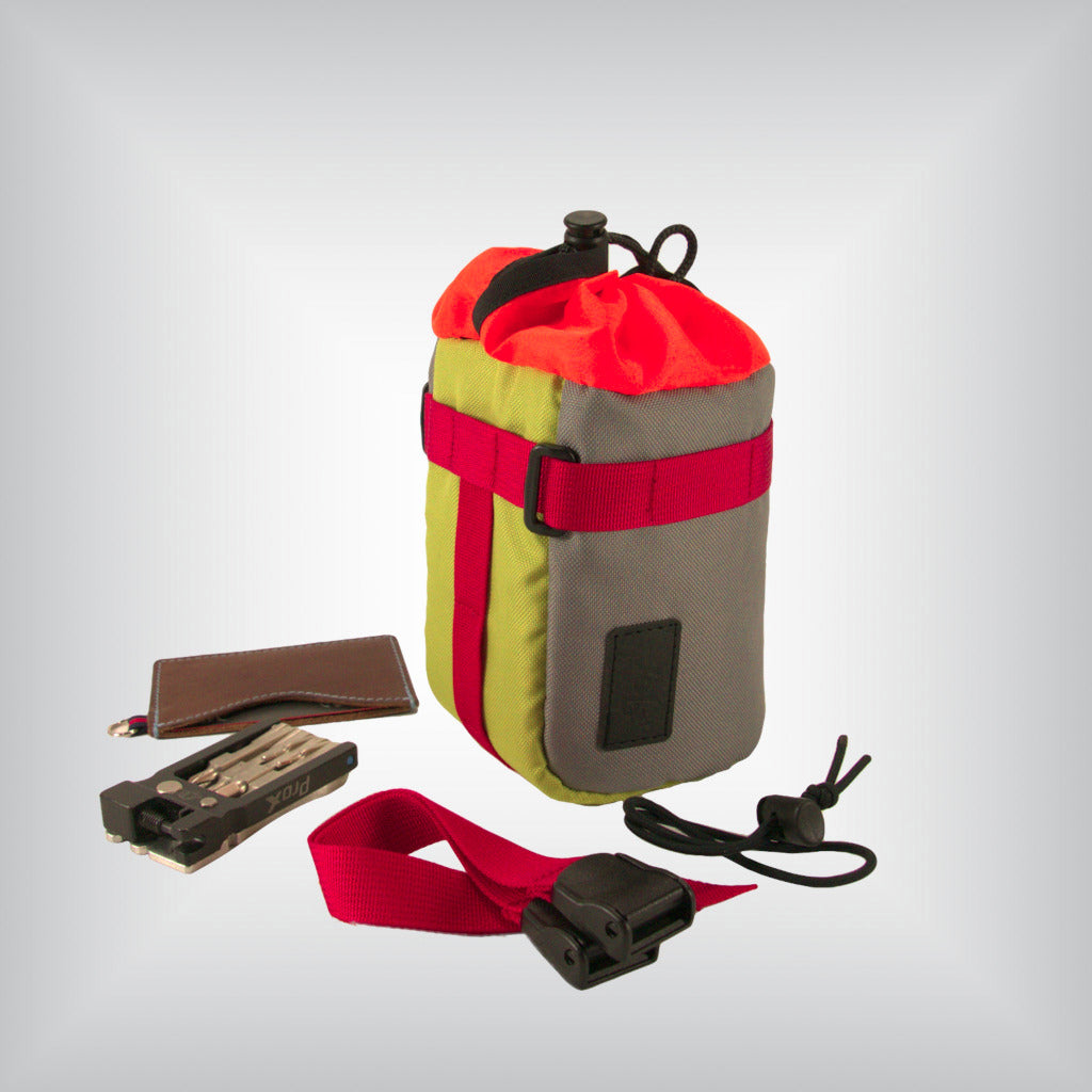 A modern-looking bikepacking bag featuring a two-tone grey and light green color scheme.