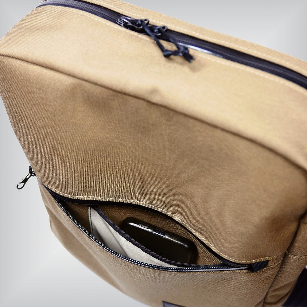 Minimalist front bag designed for Brompton bicycles, featuring padded netbook sleeve and phone slot with 'phone catcher'