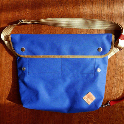 eco-friendly blue canvas messenger bag