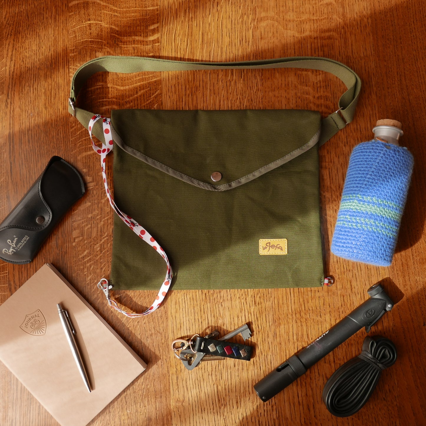 Musette with flap in olive green