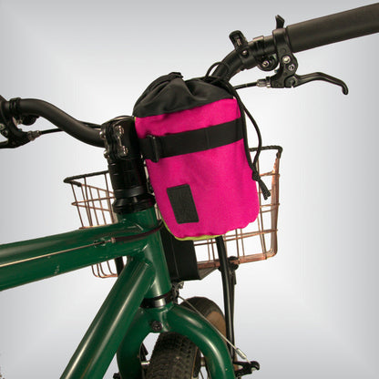 Hot pink bicycle stem bag attached to the handlebars