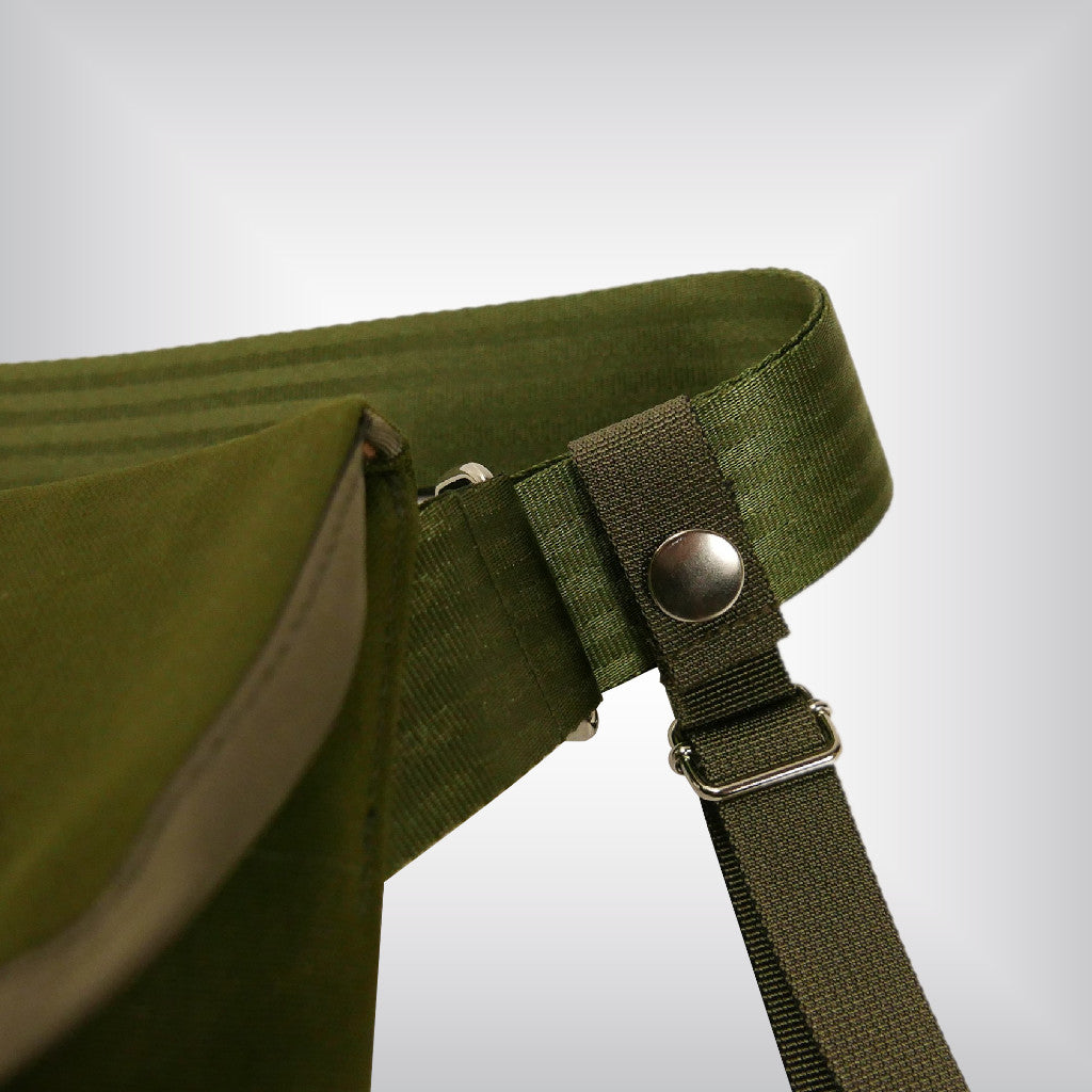 Close up of the shoulder strap in olive messenger bag