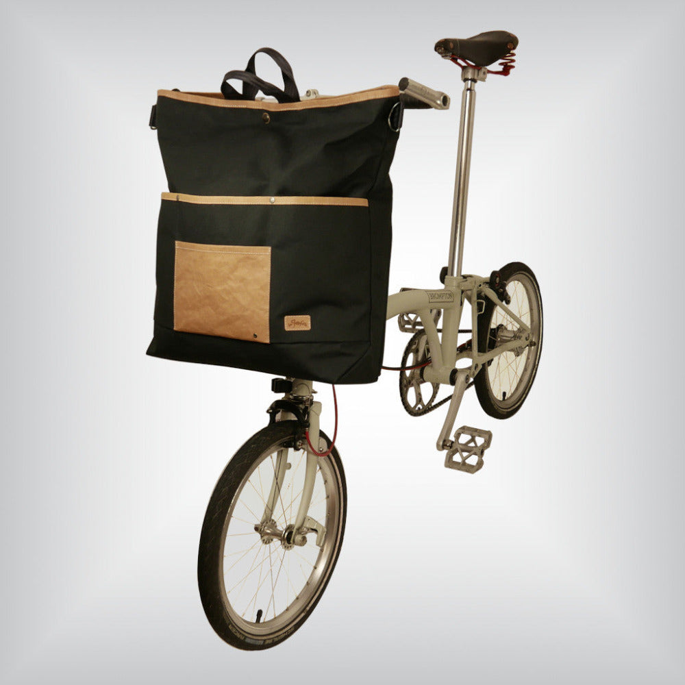 An oversized canvas tote for a Brompton folding bike.